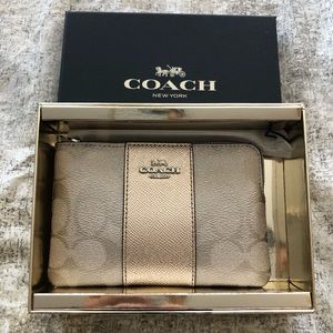 COACH metallic wristlet.